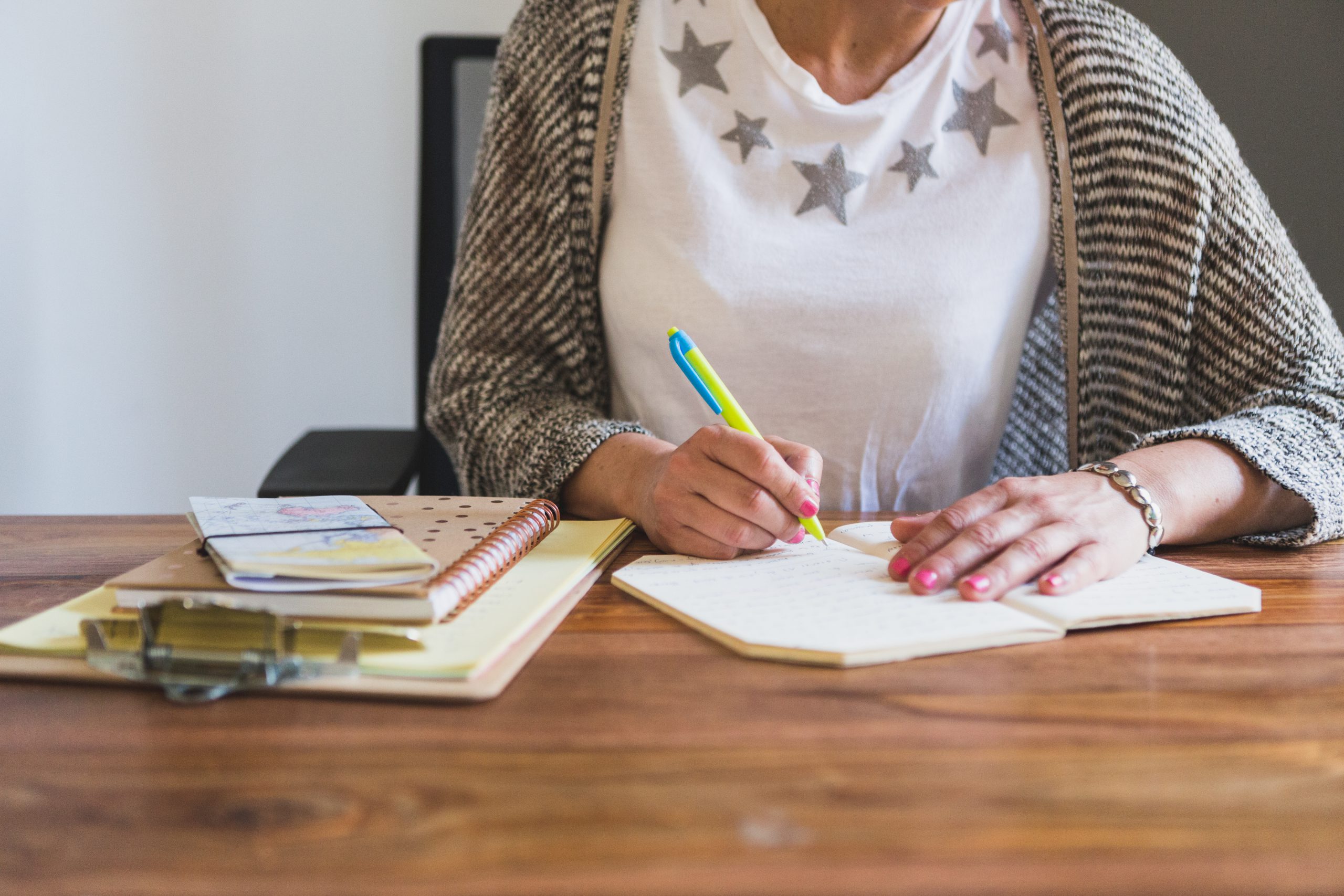 close-up-employee-writing-notebook